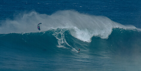 Sport photography. Jaws swell on International surfing event in Maui, Hawai 2021 December.