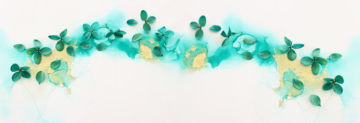 Creative image of emerald and green Hydrangea flowers on artistic ink background. Top view with copy space