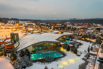 Fototapeta Bania Thermal Bath and Ski Resort Drone View at Winter. Polish Winter Capital obraz