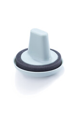 Cropped shot of a plastic blue-black dish sponge with a handle. The plastic dish sponge is isolated on the white background. Photo for catalog.