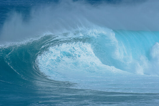 Sport photography. Jaws swell on International surfing event in Maui, Hawai 2021 December.