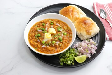  Indian Mumbai Street style Pav Bhaji, garnished with peas, raw onions, coriander, and Butter....