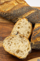 freshly baked baguettes on wooden board 