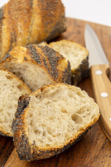 freshly baked baguettes on wooden board 