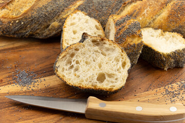 freshly baked baguettes on wooden board 