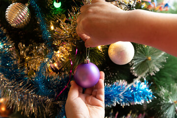 Soon Christmas and New Year, decorating the tree with toys