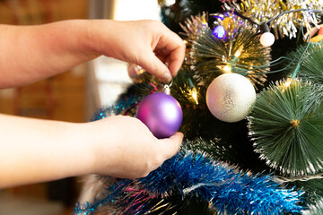 Soon Christmas and New Year, decorating the tree with toys