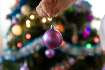 Soon Christmas and New Year, decorating the tree with toys