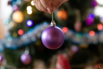 Soon Christmas and New Year, decorating the tree with toys