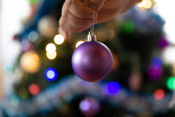 Soon Christmas and New Year, decorating the tree with toys