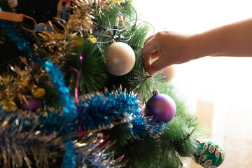 Soon Christmas and New Year, decorating the tree with toys