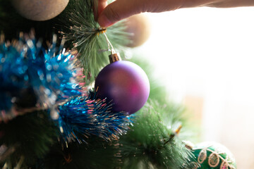 Soon Christmas and New Year, decorating the tree with toys