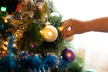 Soon Christmas and New Year, decorating the tree with toys