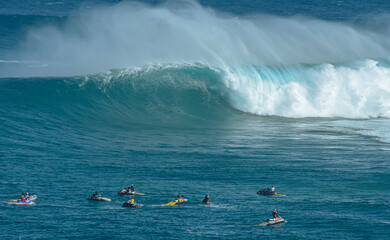 Sport photography. Jaws swell on International surfing event in Maui, Hawai 2021 December.