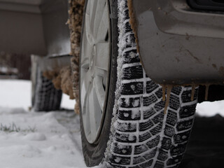 dirty snow on the fenders of the car