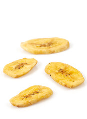 Banana chips isolated on white background. Healthy alternative snack.