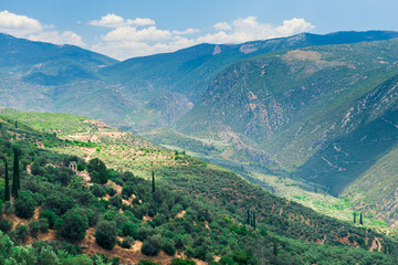 Naklejka na ściany i meble Mountain landscape. View of a green mountains on a sunny, spring day (Peloponnese, Greece)