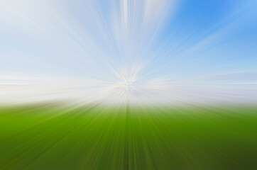 Fototapeta na wymiar abstract background diverging rays on the background of green grass and sky