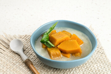 Pumpkin Kolak ( Kolak Labu Kuning) is a fast food appetizer (takjil) during Ramadan that is popular in Indonesia. Made from pumpkin, coconut milk and sugar. Served in tosca bowl, selective focus image