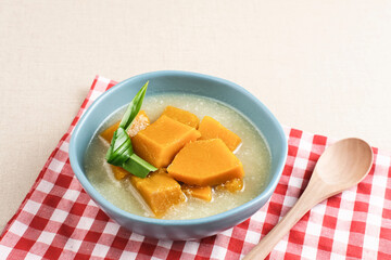 Pumpkin Kolak ( Kolak Labu Kuning) is a fast food appetizer (takjil) during Ramadan that is popular in Indonesia. Made from pumpkin, coconut milk and sugar. Served in tosca bowl, selective focus image