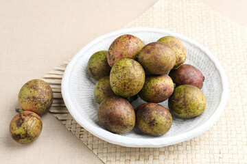 Matoa fruit from Papua, Indonesia. Matoa contains vitamin, nutrients and antioxidant. Selective focus image.
