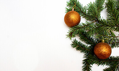 Christmas tree branches with decor on the white background. Holiday concept. Flat lay