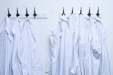 Stockholm, Sweden Laboratory coats hanging in a room.