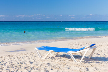 Fototapeta na wymiar Deck Chair on Tropical Beach
