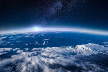 View of stars and milkyway above Earth from space. Beautiful space view of the Earth with cloud formation