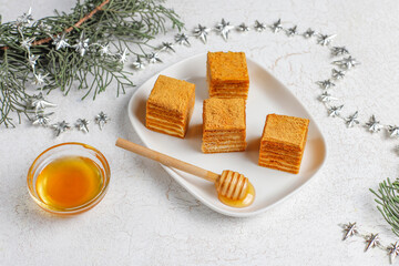 Honey cake Medovik mini slices decorated christmas sprinkles.