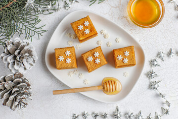 Honey cake Medovik mini slices decorated christmas sprinkles.