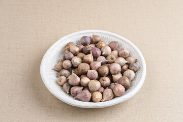 Single clover garlic or pearl garlic or solo garlic (Bawang putih tunggal) variety of Allium sativum. Selective focus image, copy space.
