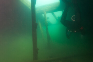 Diver in the cargo hold of the Bermuda shipwreck in the Alger Underwater Preserve in Lake Superior