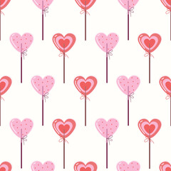 Heart shaped lollipop. Background with sweet candies. Valentine's Day seamless pattern.