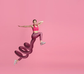 Young girl, fitness coach, runner leaping isolated on pink background. Contemporary art collage....