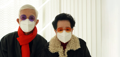 Asian senior elderly couple worry depress about Covid-19 pandemic in Winter with Omicron never...