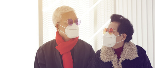 Asian senior elderly couple worry depress about Covid-19 pandemic in Winter with Omicron never ending pandemic