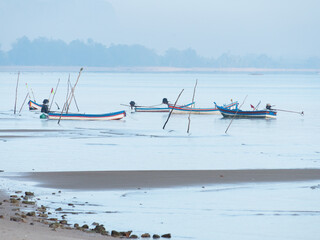 Boats at dawn in Surat Thani, Thailand