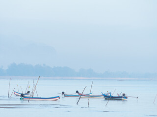 Boats at dawn in Surat Thani, Thailand