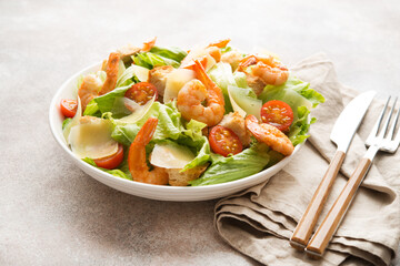 Italian caesar salad with shrimp, croutons and parmesan