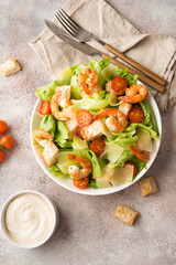 Italian caesar salad with shrimp, croutons and parmesan