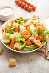 Italian caesar salad with shrimp, croutons and parmesan