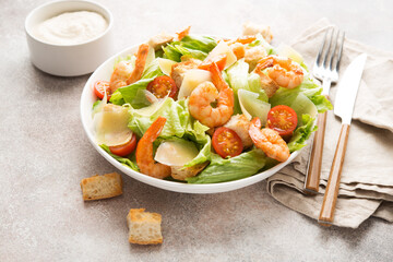 Italian caesar salad with shrimp, croutons and parmesan