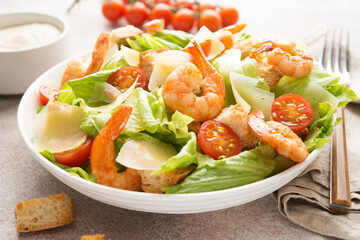 Italian caesar salad with shrimp, croutons and parmesan