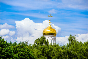 Fototapeta na wymiar Domes of the Orthodox Church with crosses against the blue sky 