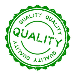 Grunge green quality word round rubber seal stamp on white background