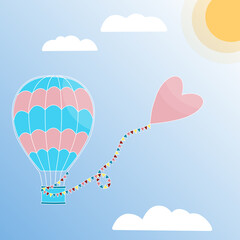 Aerostat with a heart on a string with flags flying towards the sun. Hot air balloon in the sunny sky