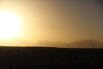 Naklejka premium Winter sunset in Mountain Range of the Arabian Desert