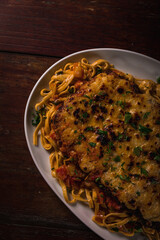 Delicious Pizza Burger Classic Homemade Tomato Sauce Sausage Cheese Onion Chicken Meat Pasta Shrimp Restaurant Menu Gourmet on a wooden table