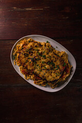 Delicious Pizza Burger Classic Homemade Tomato Sauce Sausage Cheese Onion Chicken Meat Pasta Shrimp Restaurant Menu Gourmet on a wooden table